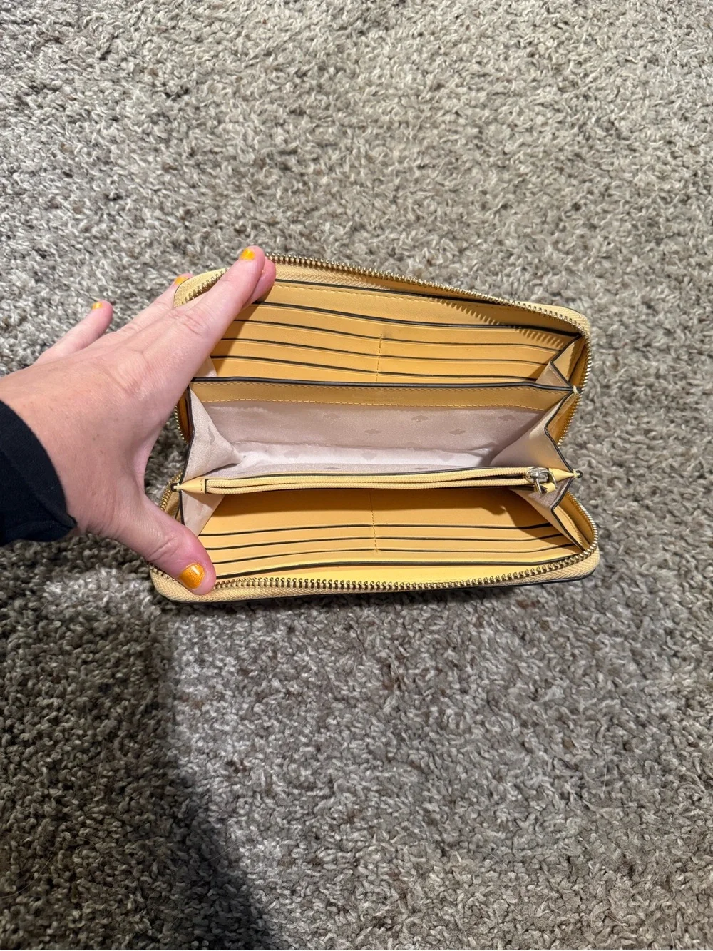 kate spade pale yellow zip-around wallet
